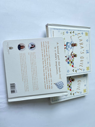 Two books titled 'Clara's Quilt' on a white background