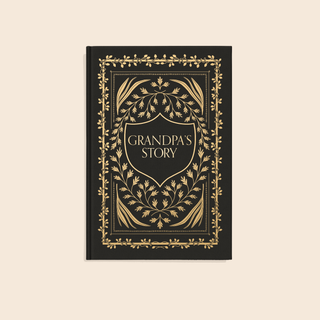 Book titled 'Grandpa's Story' with decorative gold design on a beige background