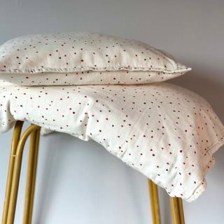 Pillow and duvet set with red heart print
